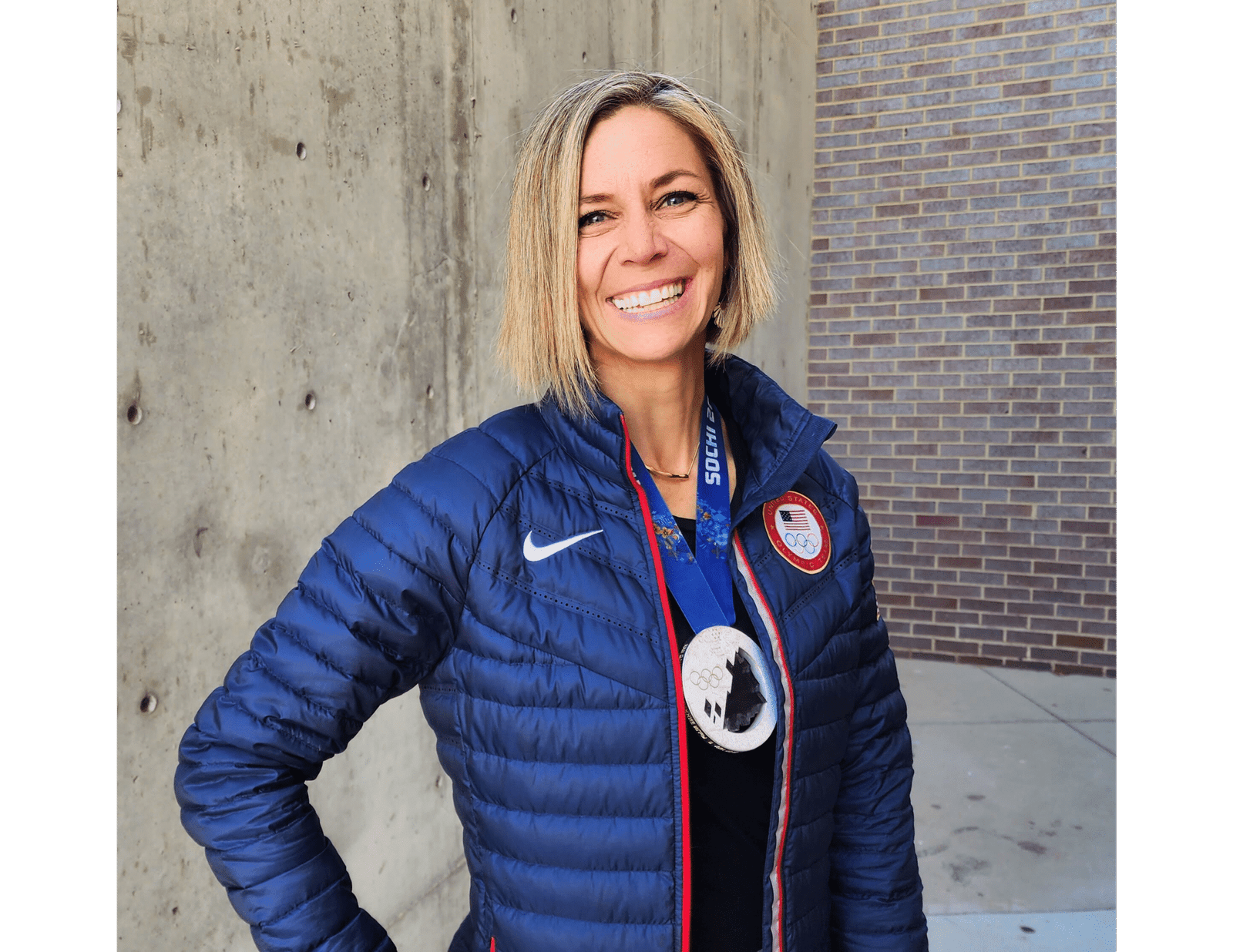 Noelle with Olympic jacket and medal