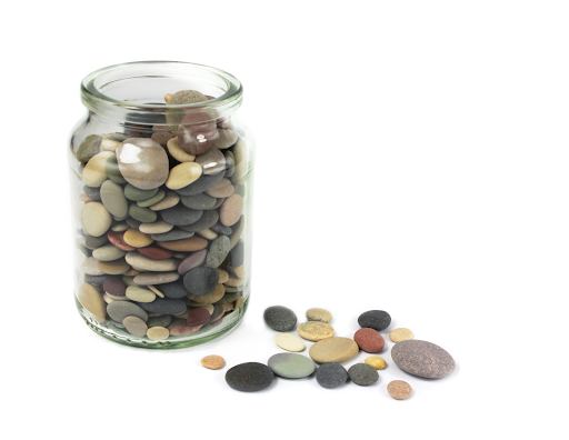 Pebbles in a jar remind us to slow down and simplify life.